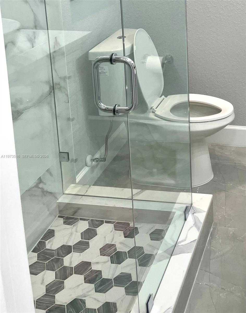 1280 West Camino Real, Unit 1280 Boca Raton, FL 33486 - Photo 14 of 26 a bathroom with a shower