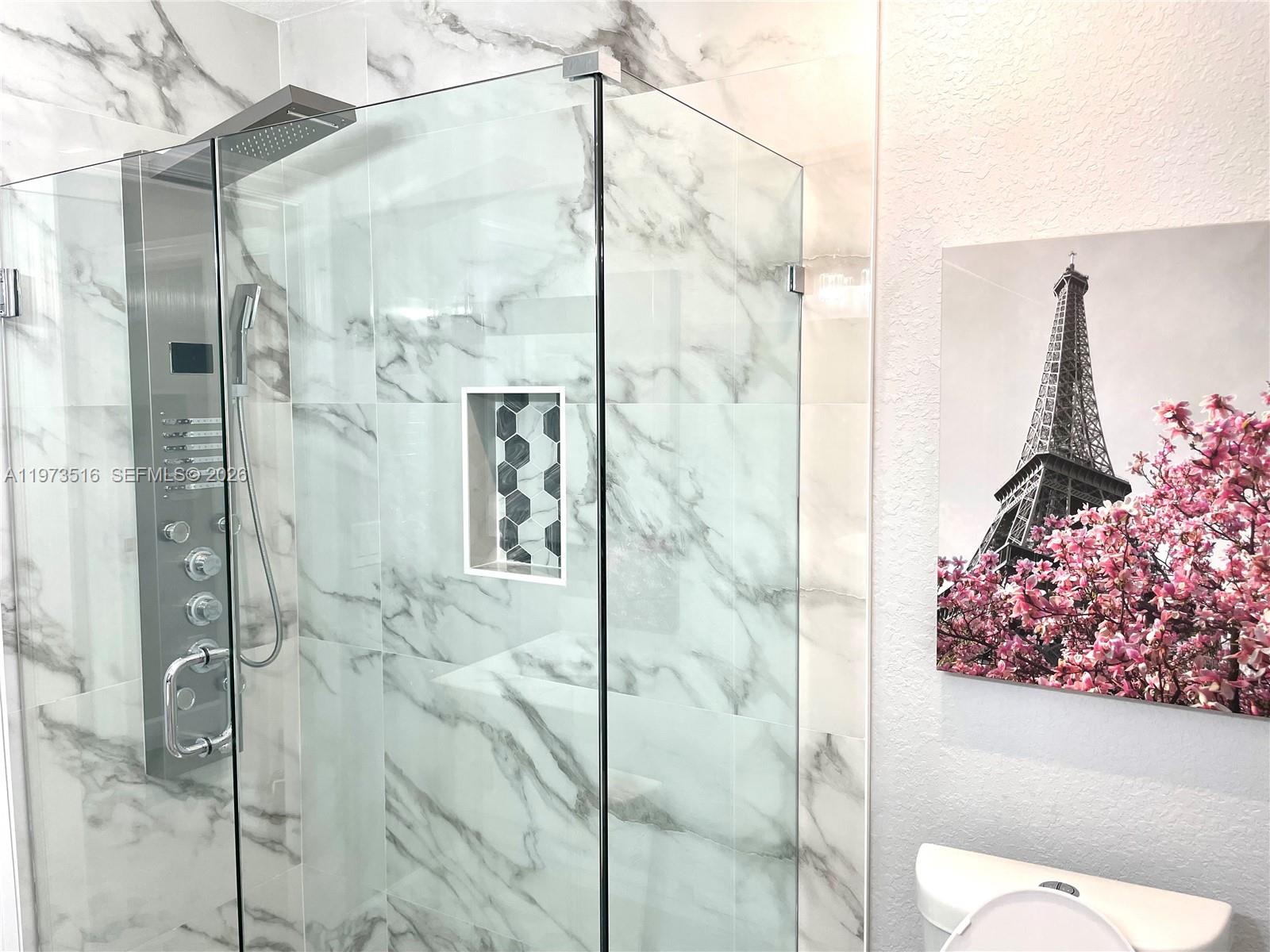 1280 West Camino Real, Unit 1280 Boca Raton, FL 33486 - Photo 15 of 26 a bathroom with a shower and toilet