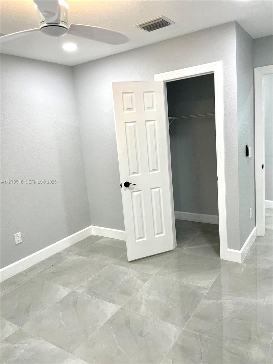 1280 West Camino Real, Unit 1280 Boca Raton, FL 33486 - Photo 20 of 26 an empty room with windows