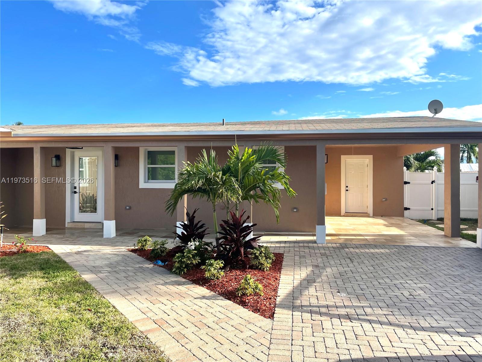 1280 West Camino Real, Unit 1280 Boca Raton, FL 33486 - Photo 22 of 26 a view of a house with backyard and sitting area