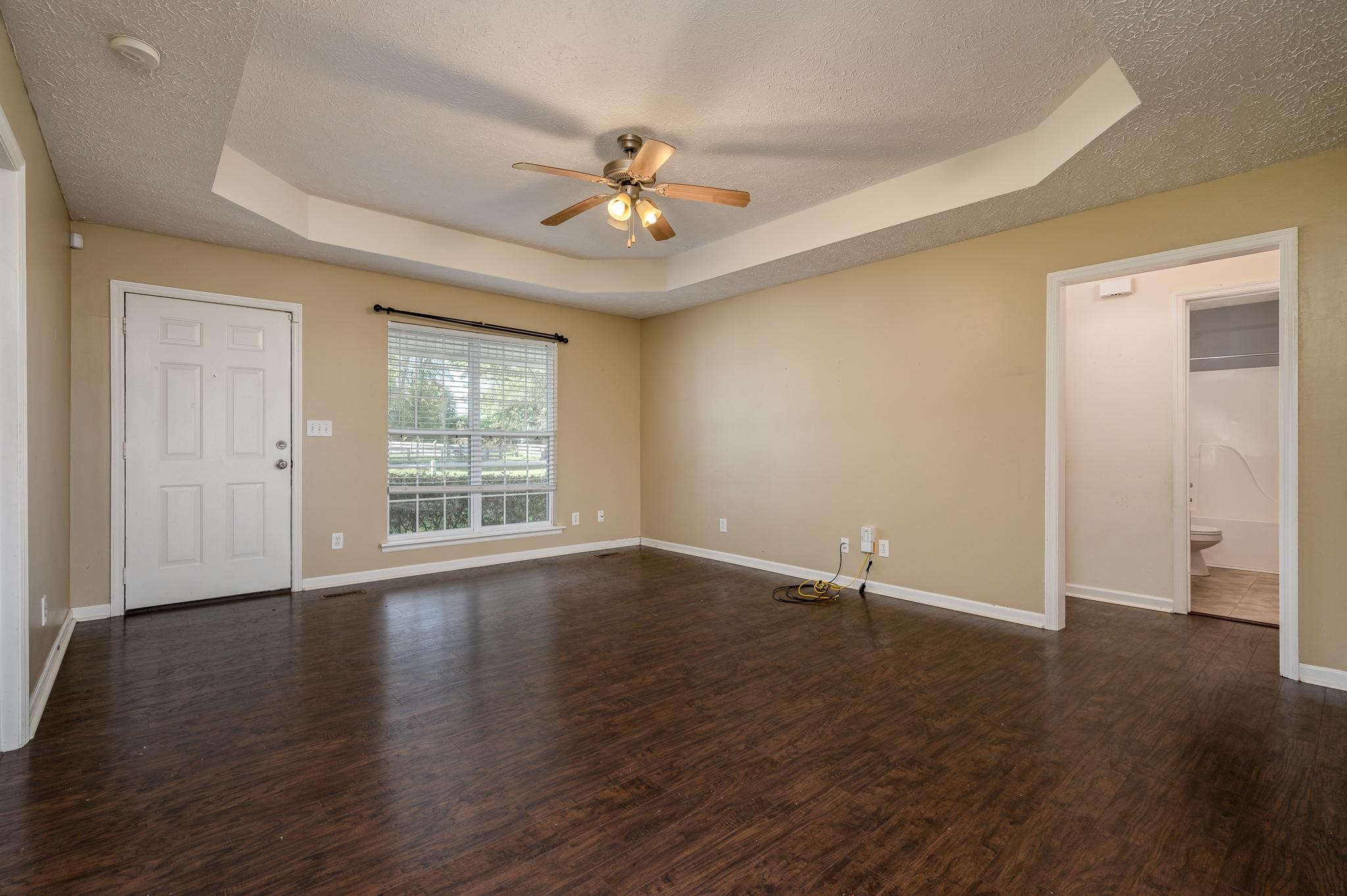 701 Crescent Road Murfreesboro, TN 37128 - Photo 3 of 22 an empty room with wooden floor and windows