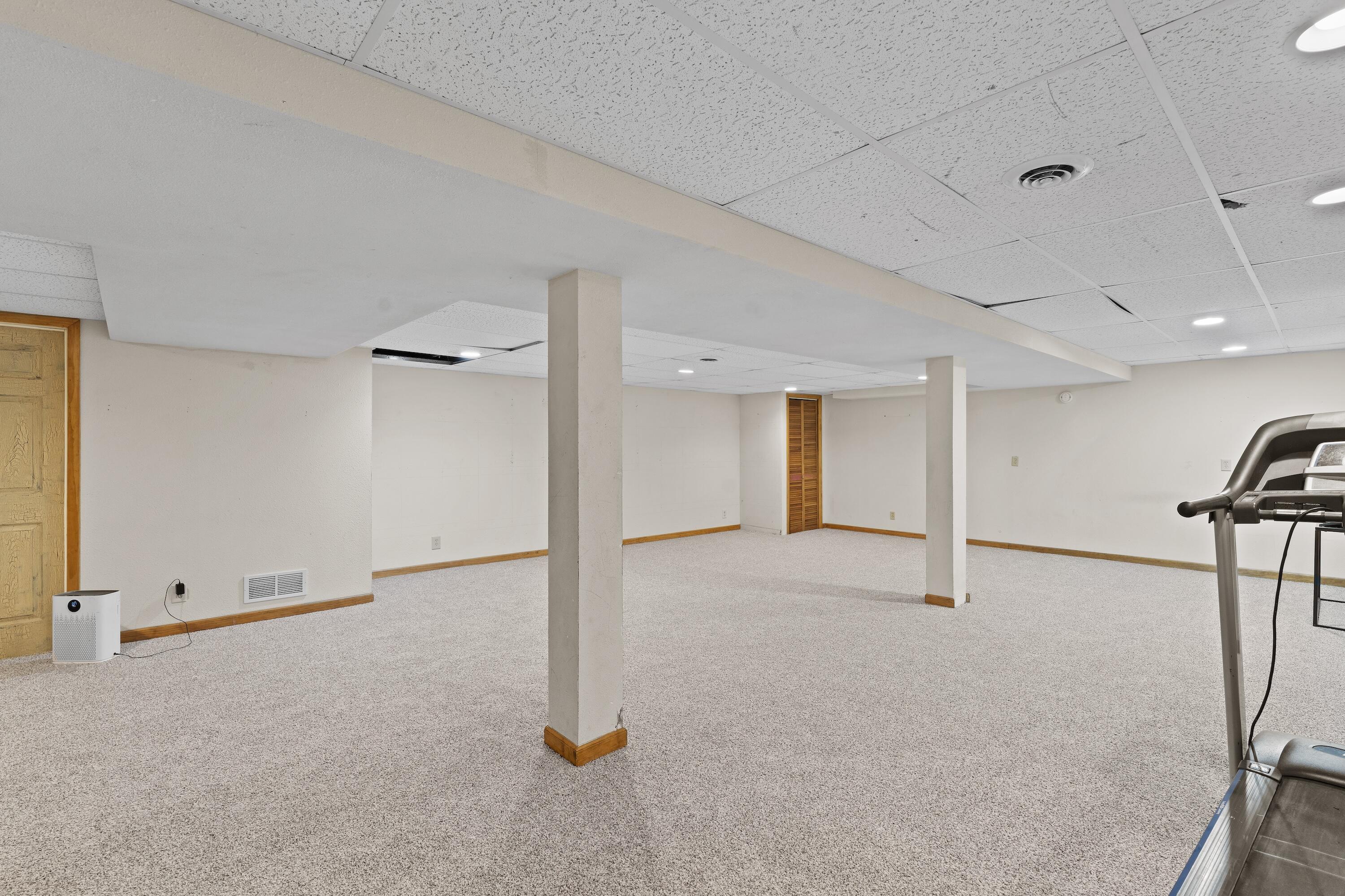 N8093 Lakeview Road Oconomowoc, WI 53066 - Photo 29 of 44 Large rec room, perfect for games, entertaining, and fitness!