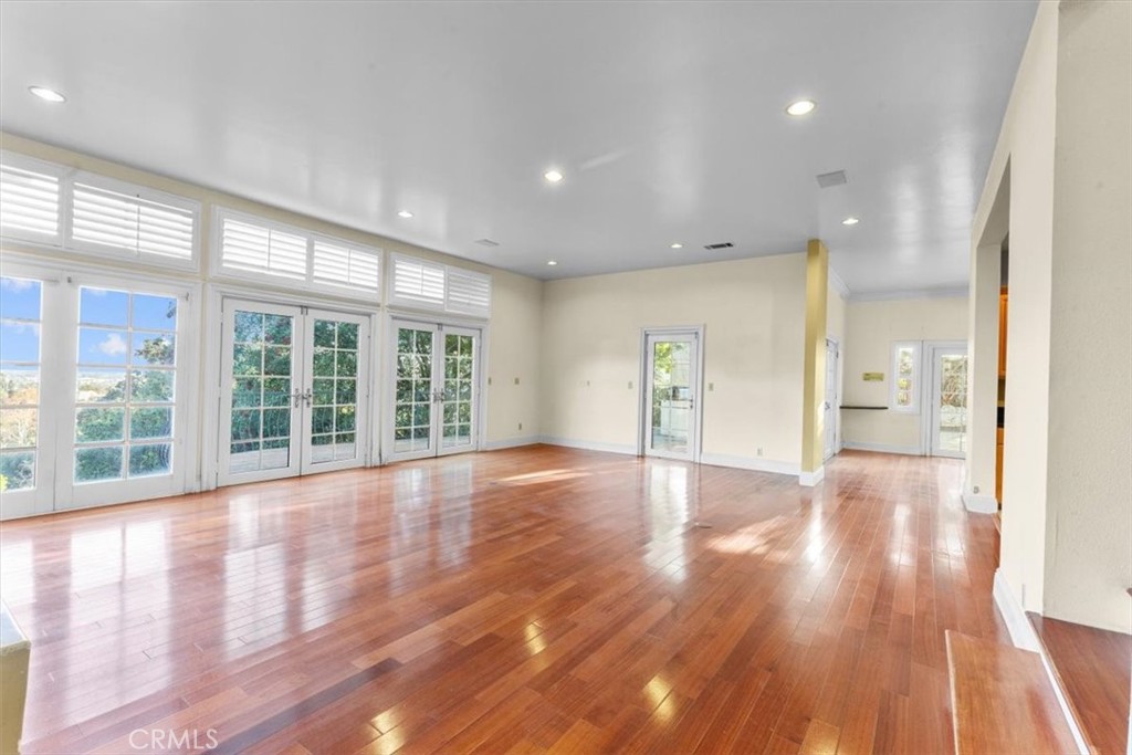 1500 Kashlan Road La Habra Heights, CA 90631 - Photo 21 of 62 a view of an empty room with wooden floor and a window