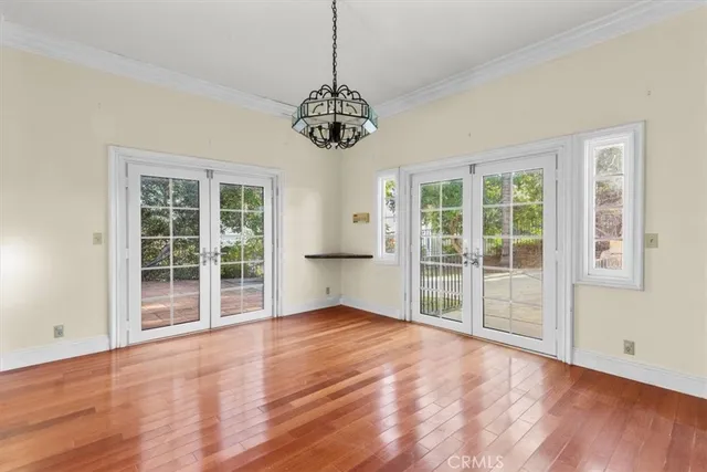a kitchen with granite countertop a stove sink and microwave
