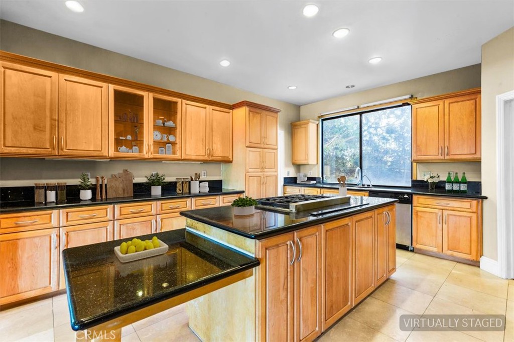 1500 Kashlan Road La Habra Heights, CA 90631 - Photo 32 of 62 a kitchen with stainless steel appliances granite countertop sink stove and refrigerator