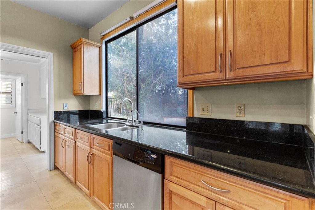 1500 Kashlan Road La Habra Heights, CA 90631 - Photo 35 of 62 a kitchen with stainless steel appliances granite countertop a sink a stove and a microwave oven