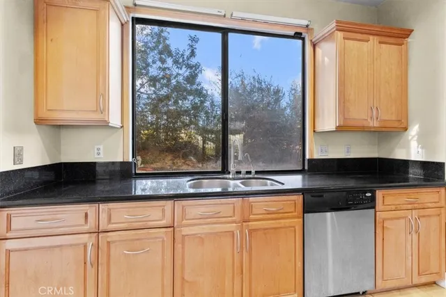 an empty room with wooden floor and sliding door