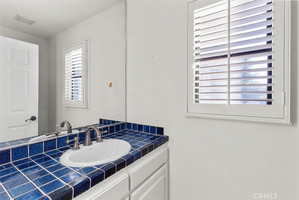 1500 Kashlan Road La Habra Heights, CA 90631 - Photo 39 of 62 a bathroom with a granite countertop sink and a mirror
