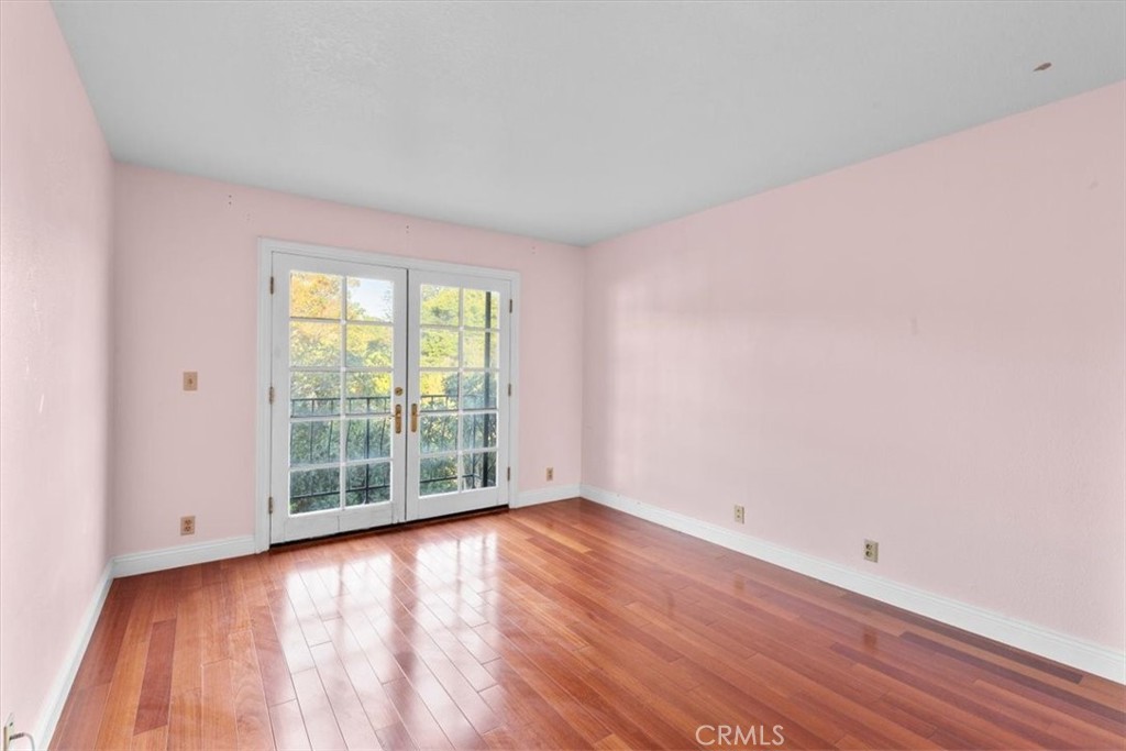 1500 Kashlan Road La Habra Heights, CA 90631 - Photo 43 of 62 an empty room with wooden floor and windows