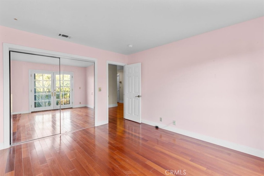 1500 Kashlan Road La Habra Heights, CA 90631 - Photo 45 of 62 a view of an empty room with wooden floor and a window