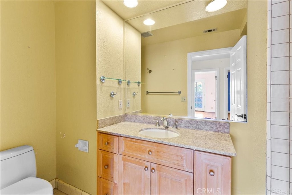 1500 Kashlan Road La Habra Heights, CA 90631 - Photo 46 of 62 a bathroom with a granite countertop sink toilet and shower