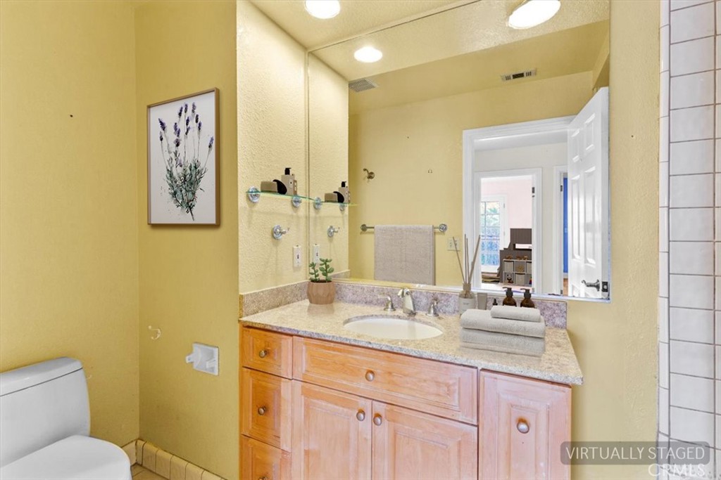 1500 Kashlan Road La Habra Heights, CA 90631 - Photo 47 of 62 a bathroom with a granite countertop sink and a mirror