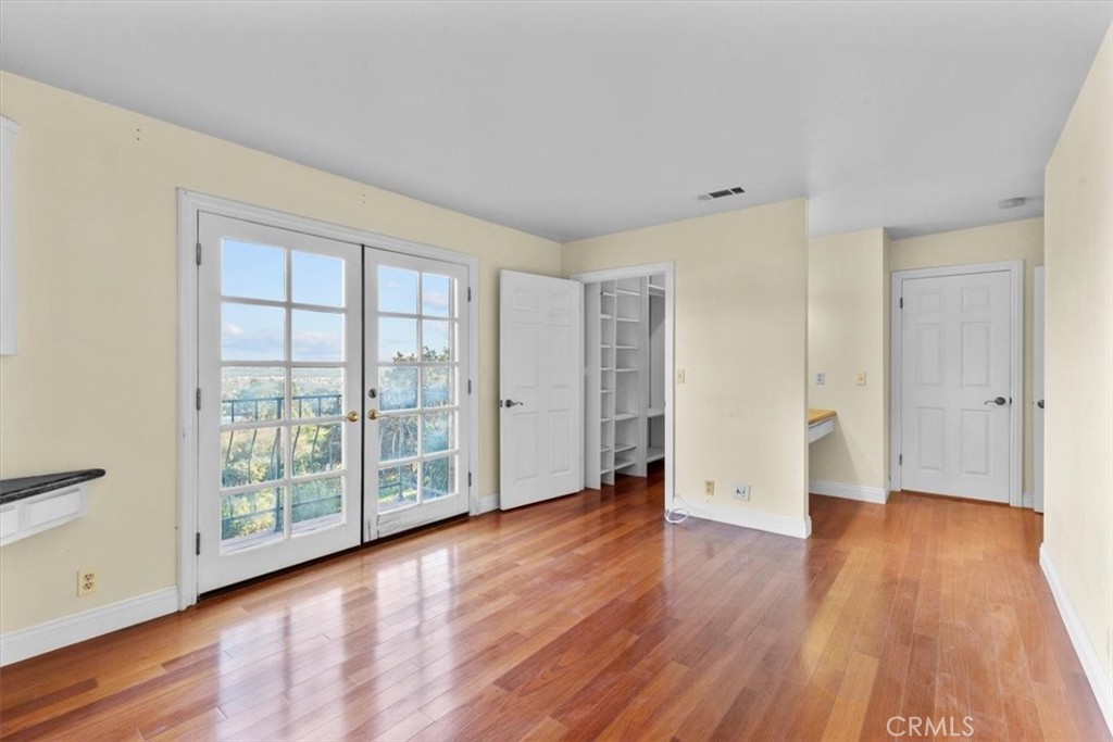 1500 Kashlan Road La Habra Heights, CA 90631 - Photo 50 of 62 a view of an empty room with wooden floor and a window