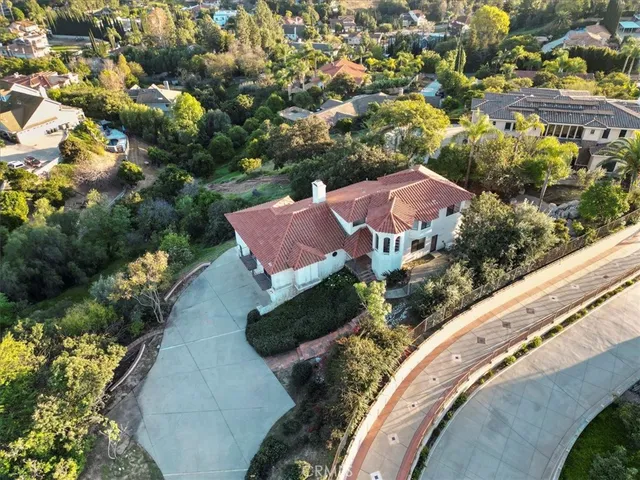 an aerial view of a house with a garden