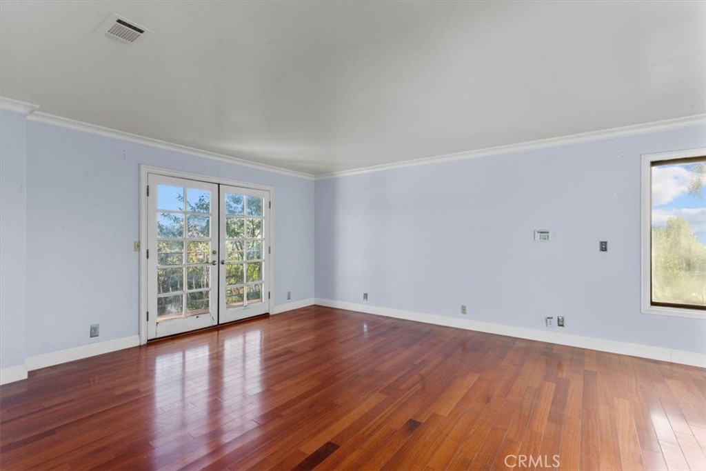 1500 Kashlan Road La Habra Heights, CA 90631 - Photo 57 of 62 wooden floor in an empty room with a window
