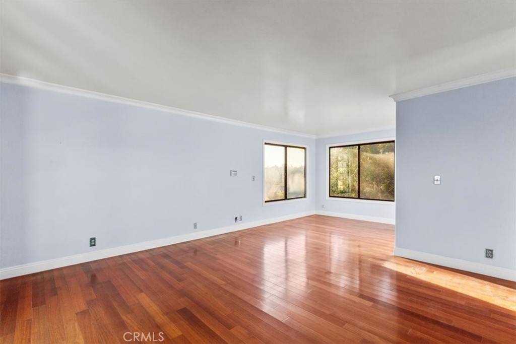1500 Kashlan Road La Habra Heights, CA 90631 - Photo 58 of 62 a view of an empty room with wooden floor and windows