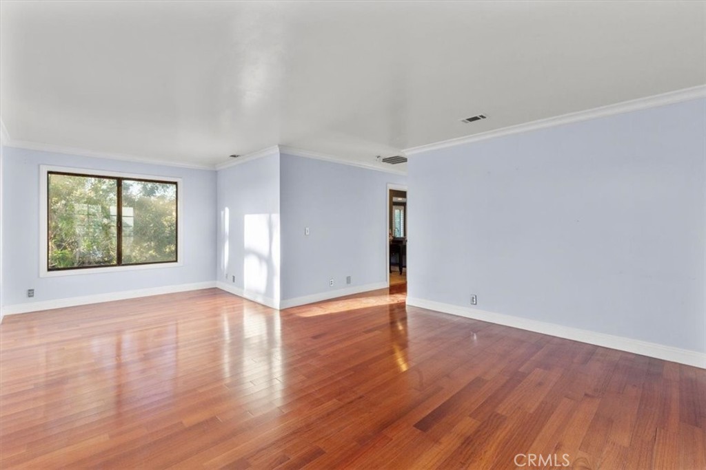 1500 Kashlan Road La Habra Heights, CA 90631 - Photo 59 of 62 a view of an empty room with wooden floor and a window