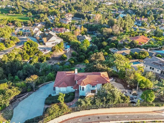 an aerial view of house with yard