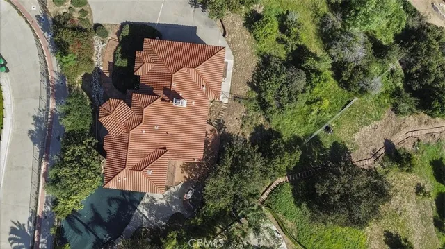 an aerial view of house with yard