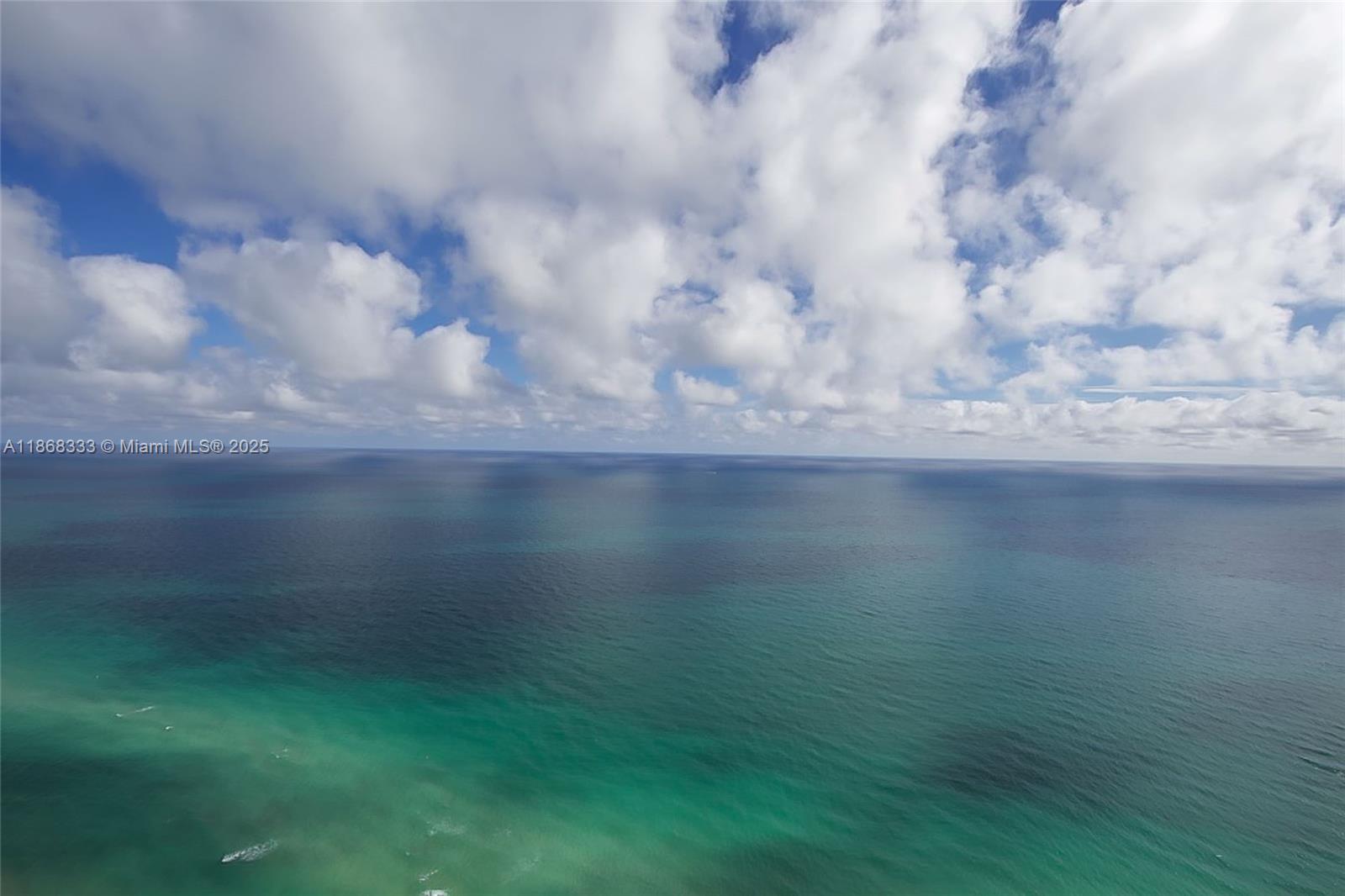 18555 Collins Avenue, Unit 4605 Sunny Isles Beach, FL 33160 - Photo 1 of 40 a view of a lake