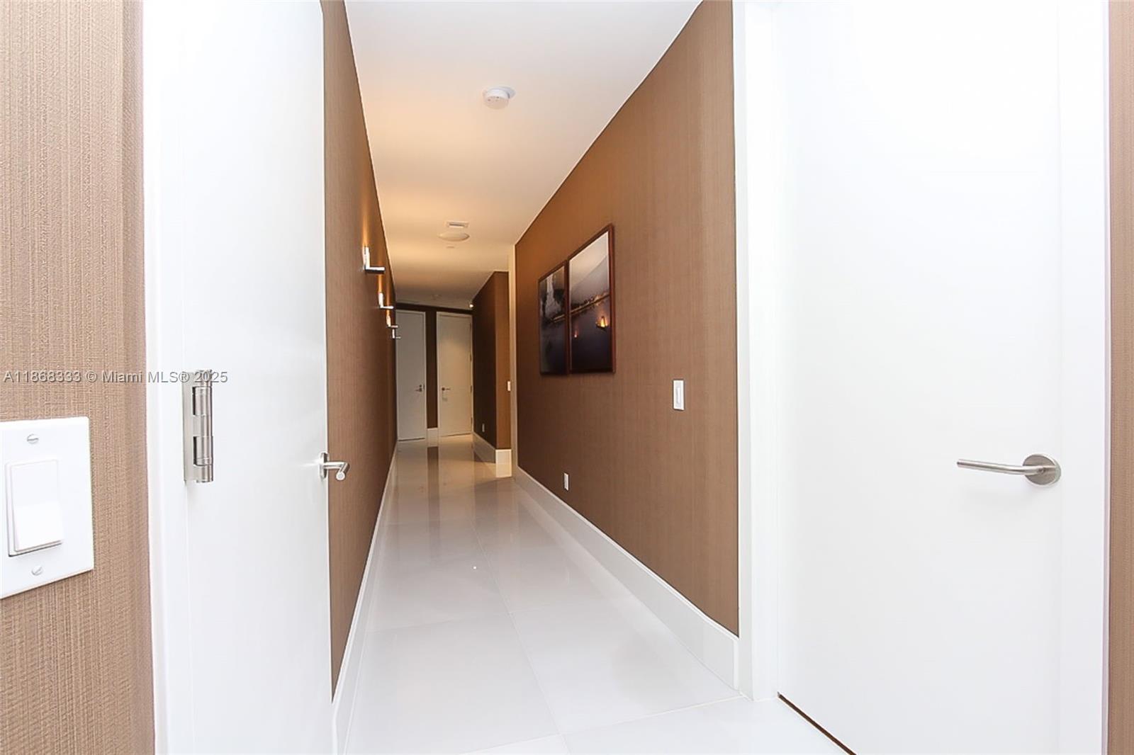 18555 Collins Avenue, Unit 4605 Sunny Isles Beach, FL 33160 - Photo 30 of 40 a view of a hallway with hallway