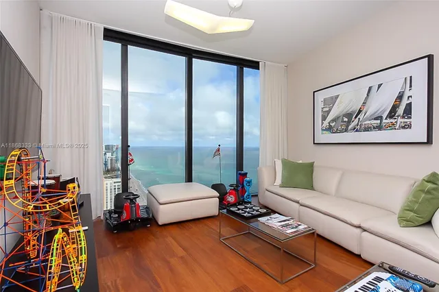 a living room with furniture and a large window