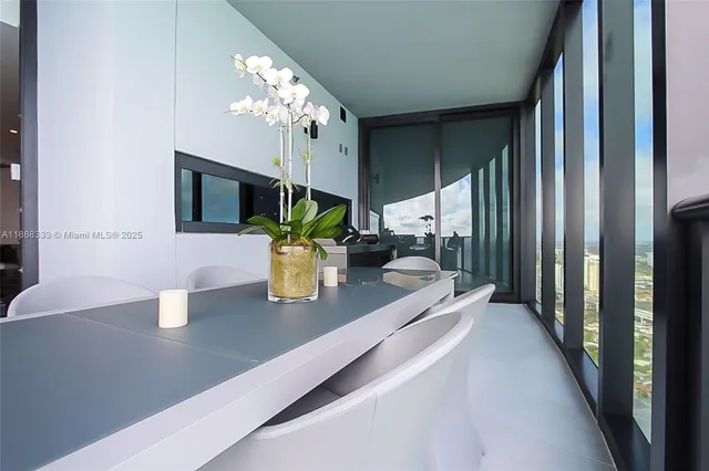 a kitchen with a sink and chandelier