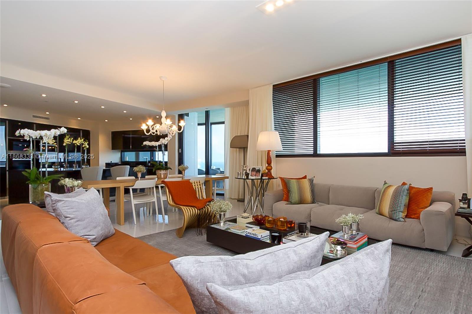 18555 Collins Avenue, Unit 4605 Sunny Isles Beach, FL 33160 - Photo 10 of 40 a living room with furniture and a large window