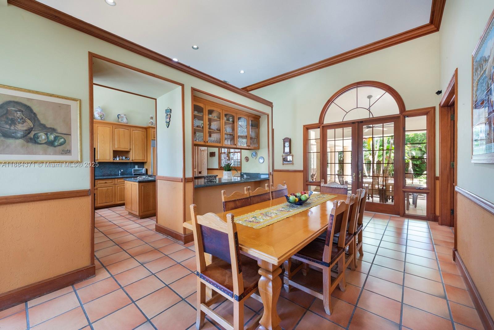 9360 Southwest 66th Street Miami, FL 33173 - Photo 19 of 64 a view of a dining room with furniture window and wooden floor