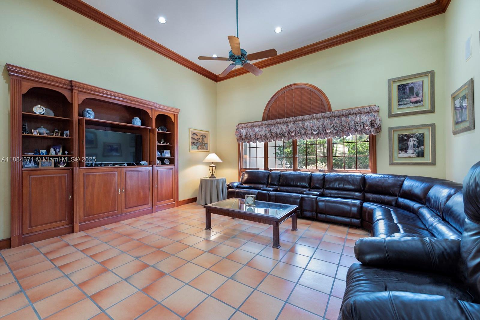 9360 Southwest 66th Street Miami, FL 33173 - Photo 21 of 64 a living room with furniture and a flat screen tv