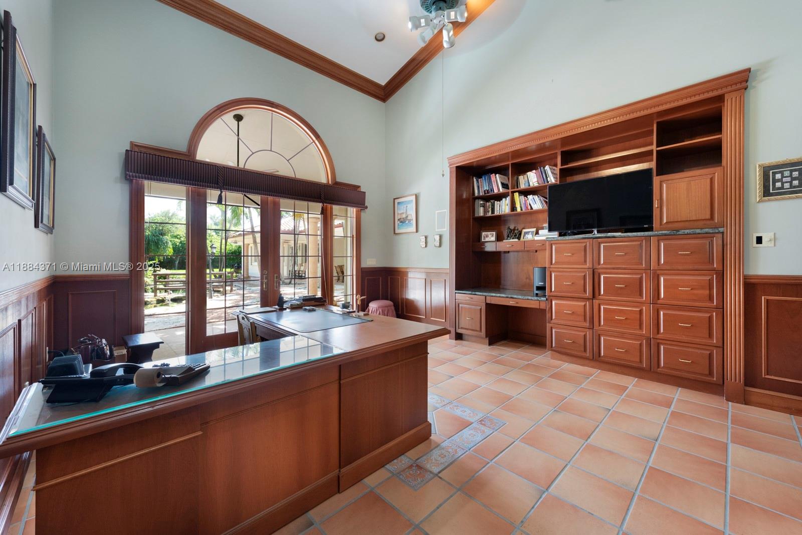 9360 Southwest 66th Street Miami, FL 33173 - Photo 22 of 64 a large kitchen with stainless steel appliances a stove a sink and a microwave