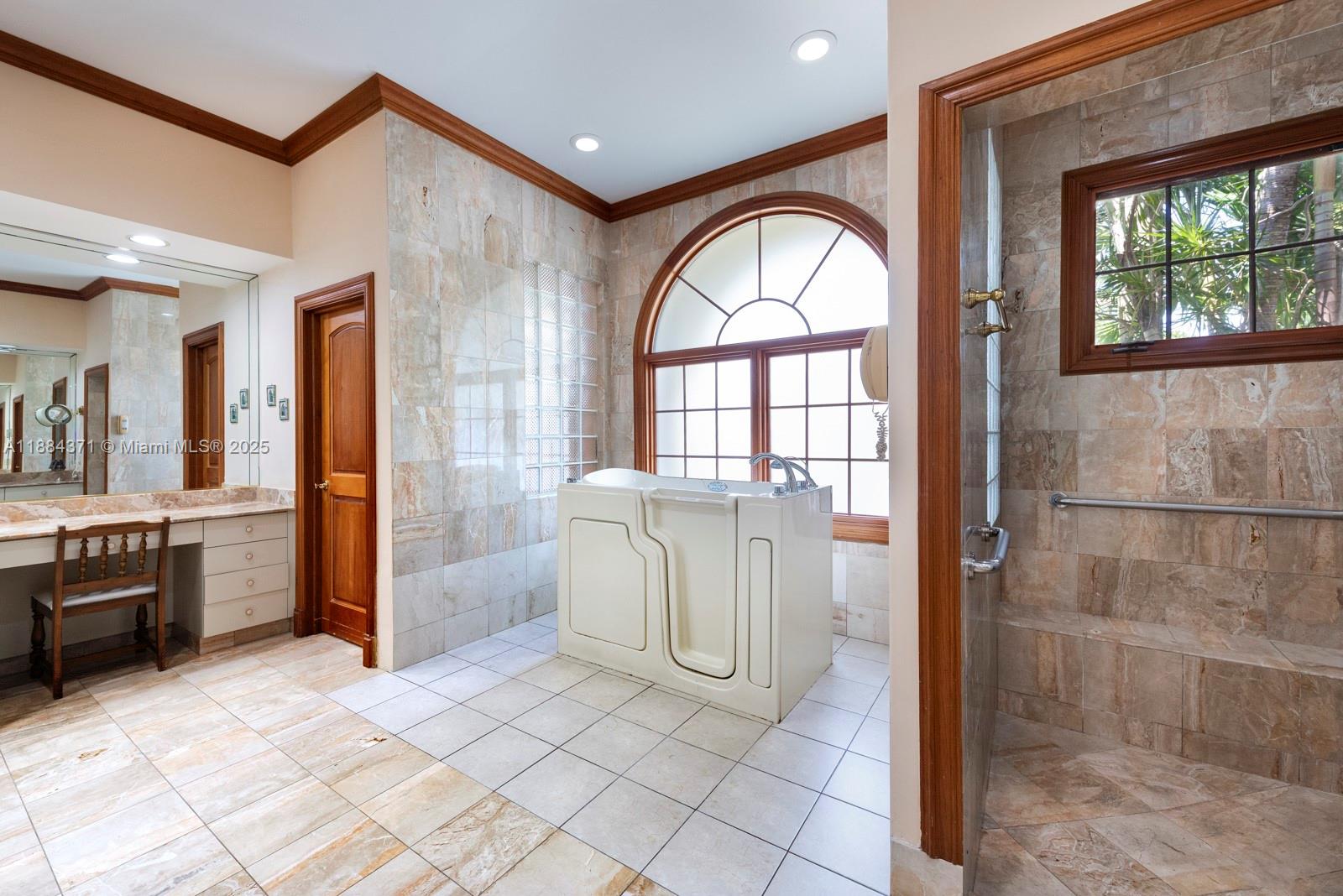 9360 Southwest 66th Street Miami, FL 33173 - Photo 26 of 64 a view of a bathroom with a bathtub and a shower