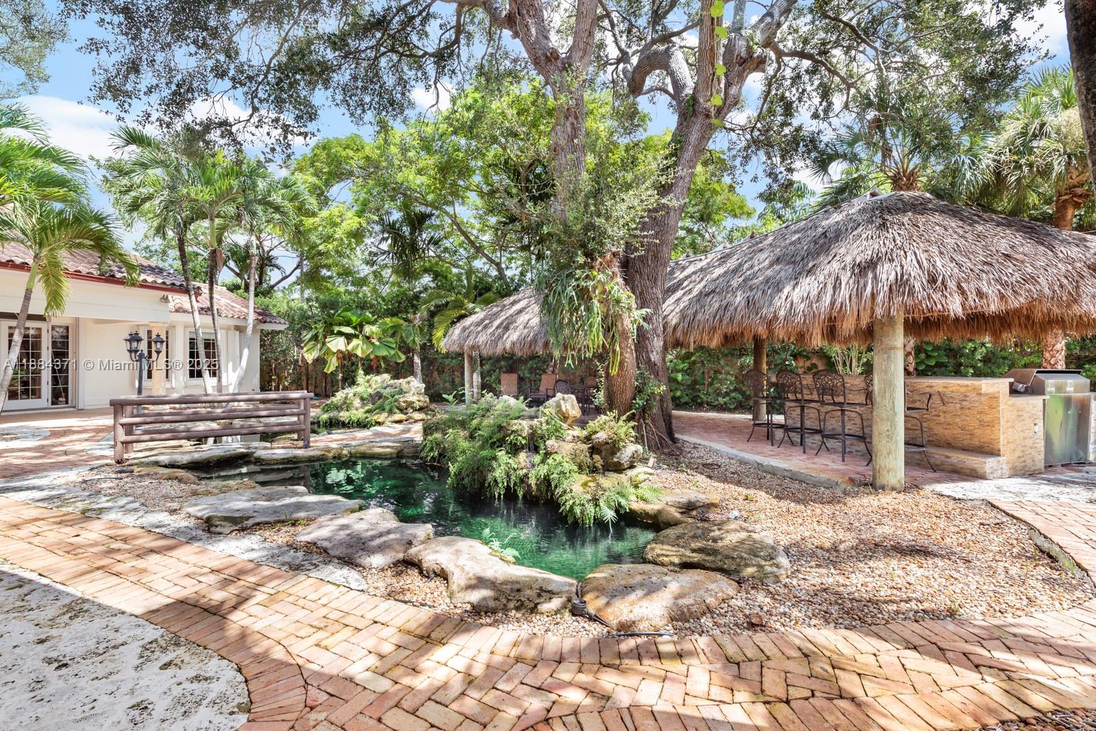 9360 Southwest 66th Street Miami, FL 33173 - Photo 32 of 64 a view of a backyard with sitting area and furniture
