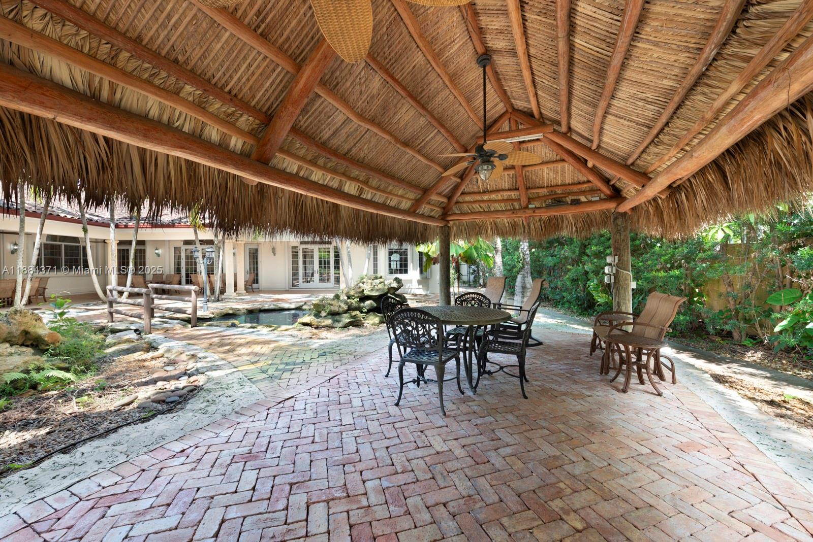 9360 Southwest 66th Street Miami, FL 33173 - Photo 34 of 64 a view of a patio with table and chairs and potted plants