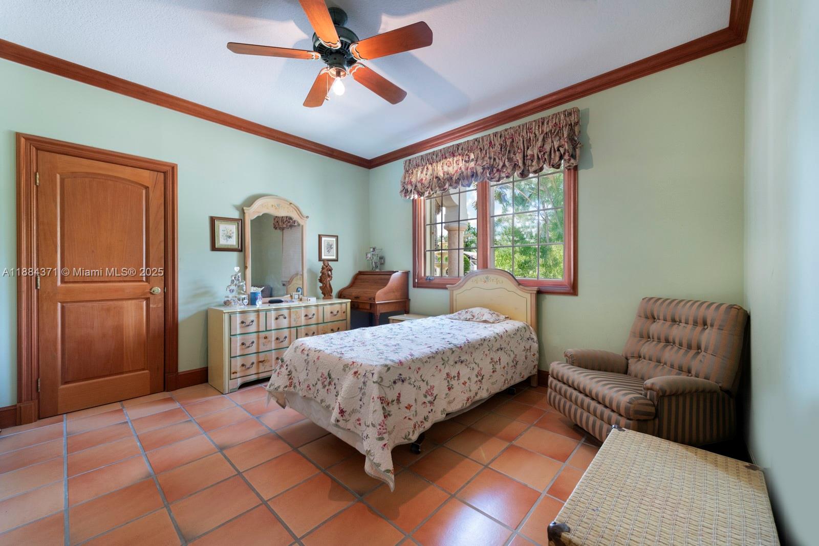 9360 Southwest 66th Street Miami, FL 33173 - Photo 38 of 64 a bedroom with a bed wooden floor and window