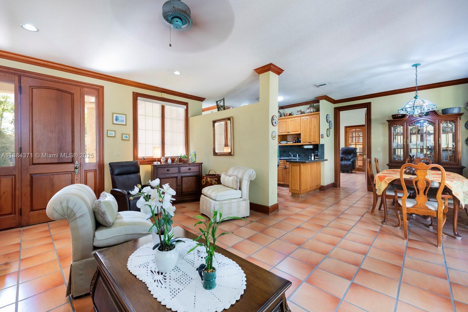 9360 Southwest 66th Street Miami, FL 33173 - Photo 42 of 64 a living room with fireplace furniture and a large window