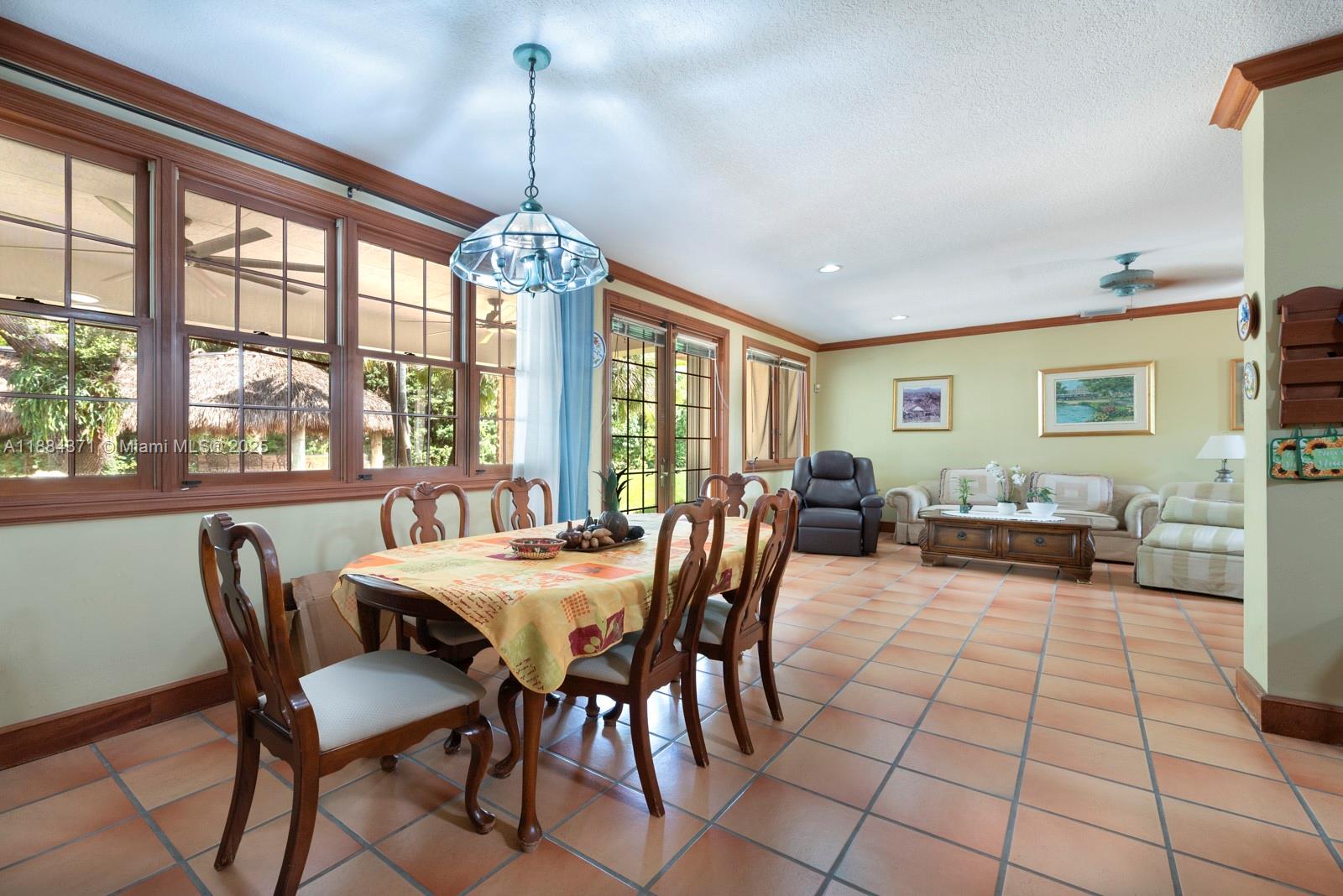 9360 Southwest 66th Street Miami, FL 33173 - Photo 43 of 64 a view of a dining room with furniture window and outside view