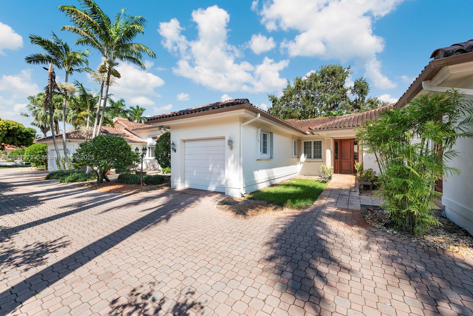 9360 Southwest 66th Street Miami, FL 33173 - Photo 50 of 64 a view of a backyard with plants and a patio