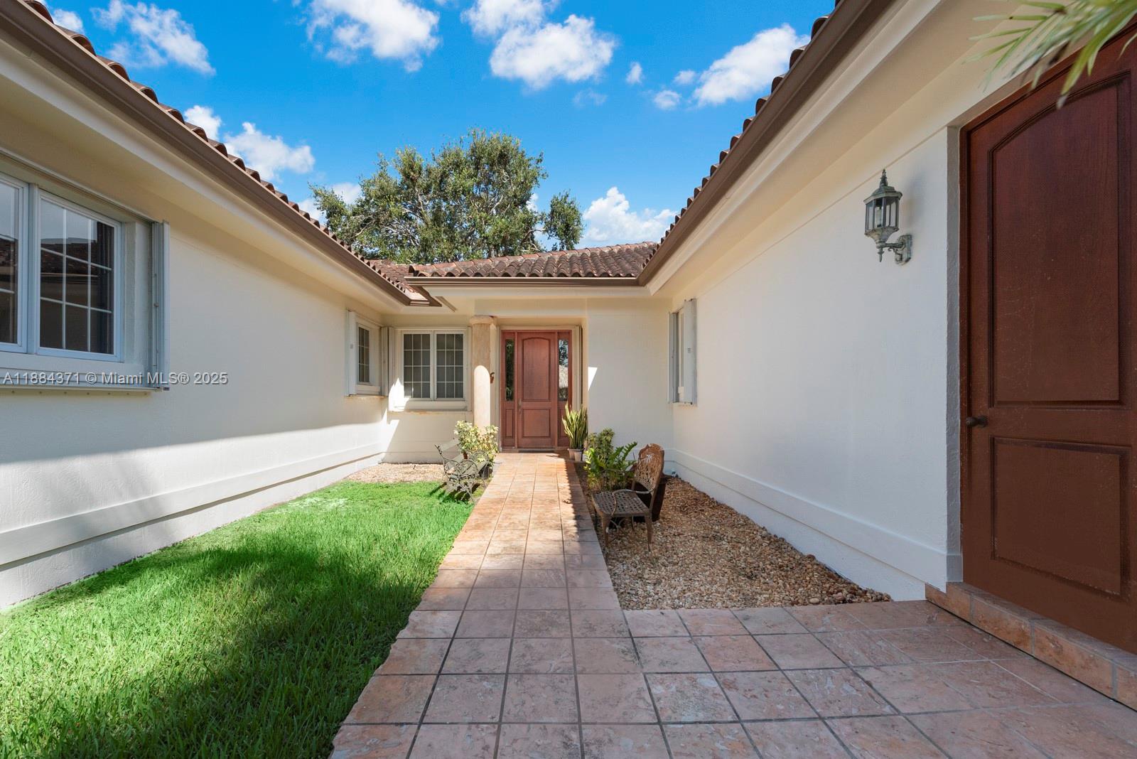 9360 Southwest 66th Street Miami, FL 33173 - Photo 51 of 64 a view of a house with backyard