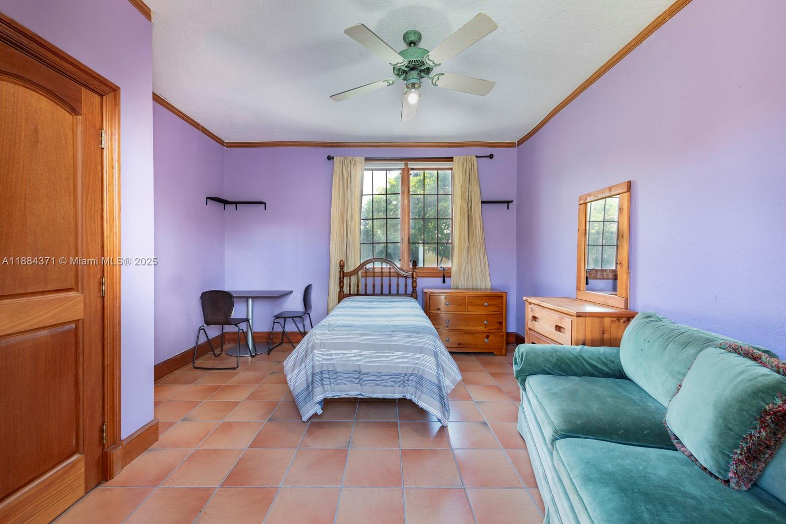 9360 Southwest 66th Street Miami, FL 33173 - Photo 52 of 64 a living room with furniture and a window