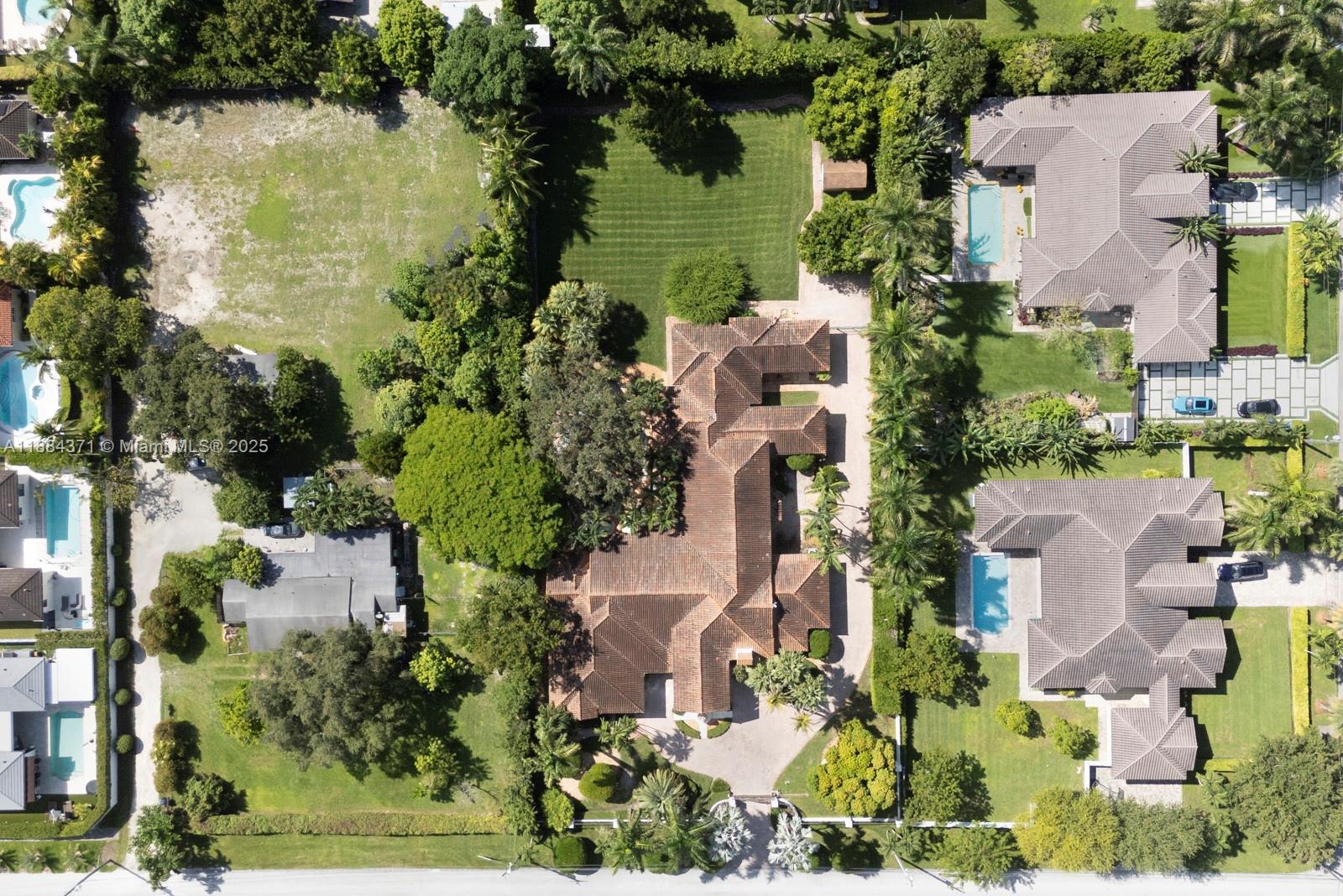 9360 Southwest 66th Street Miami, FL 33173 - Photo 55 of 64 an aerial view of a house with outdoor space and lake view