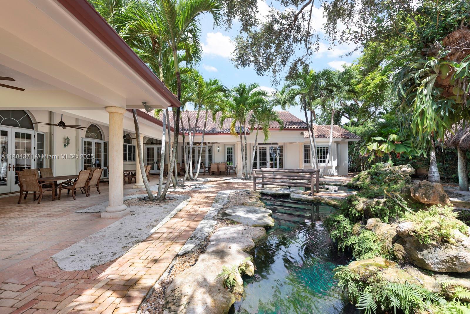9360 Southwest 66th Street Miami, FL 33173 - Photo 6 of 64 a view of a house with backyard and sitting area