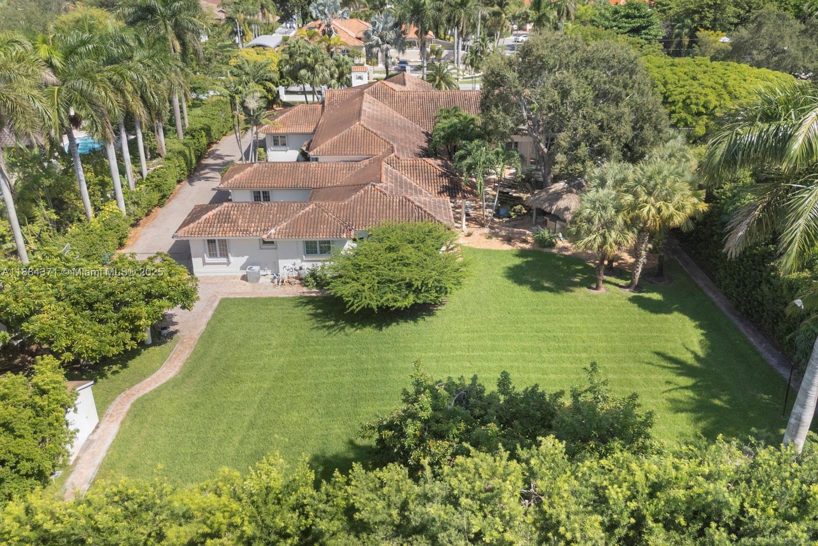 9360 Southwest 66th Street Miami, FL 33173 - Photo 7 of 64 an aerial view of a house with a yard
