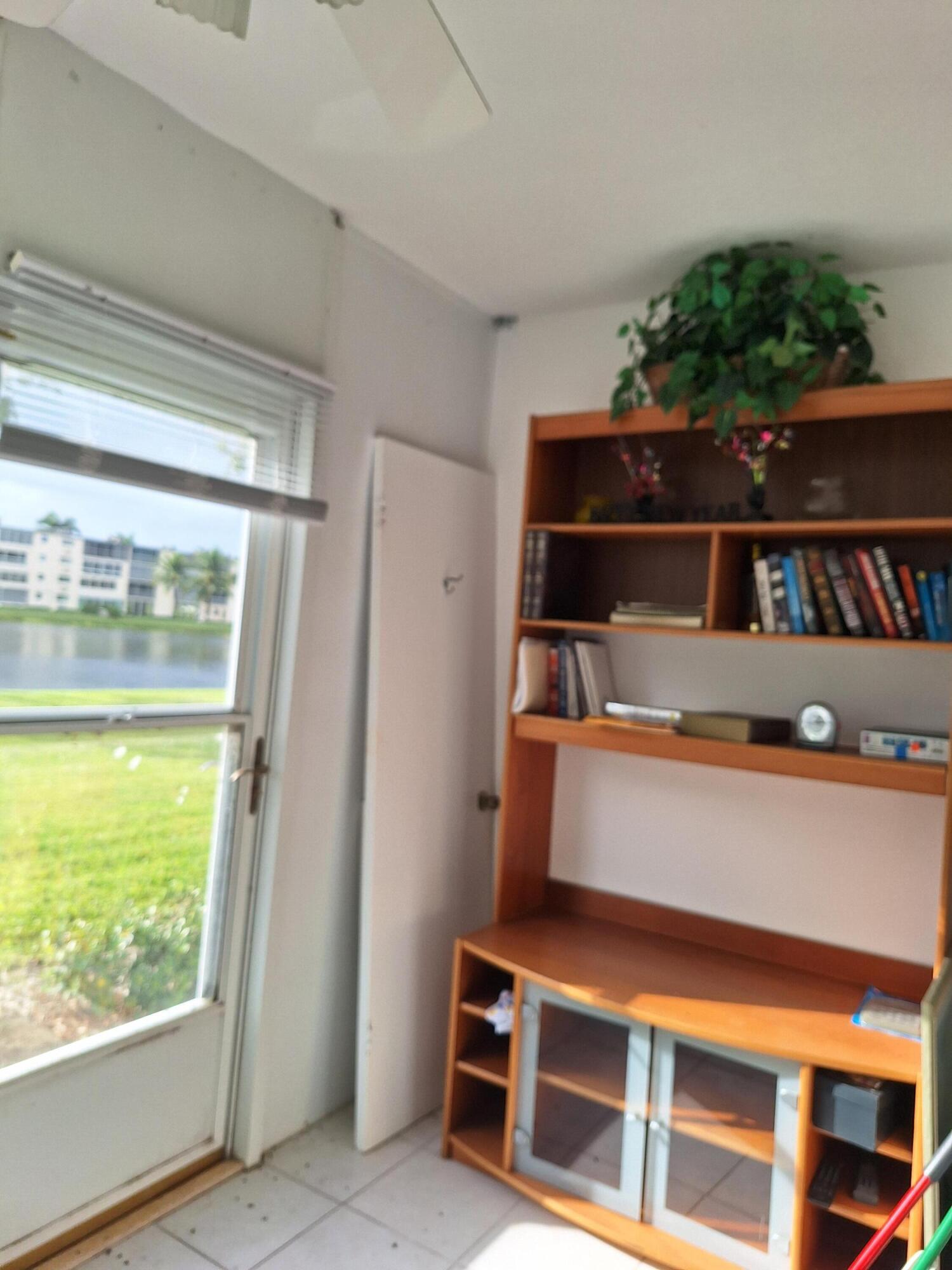1010 Wolverton East Boca Raton, FL 33434 - Photo 12 of 30 a room with furniture and a window
