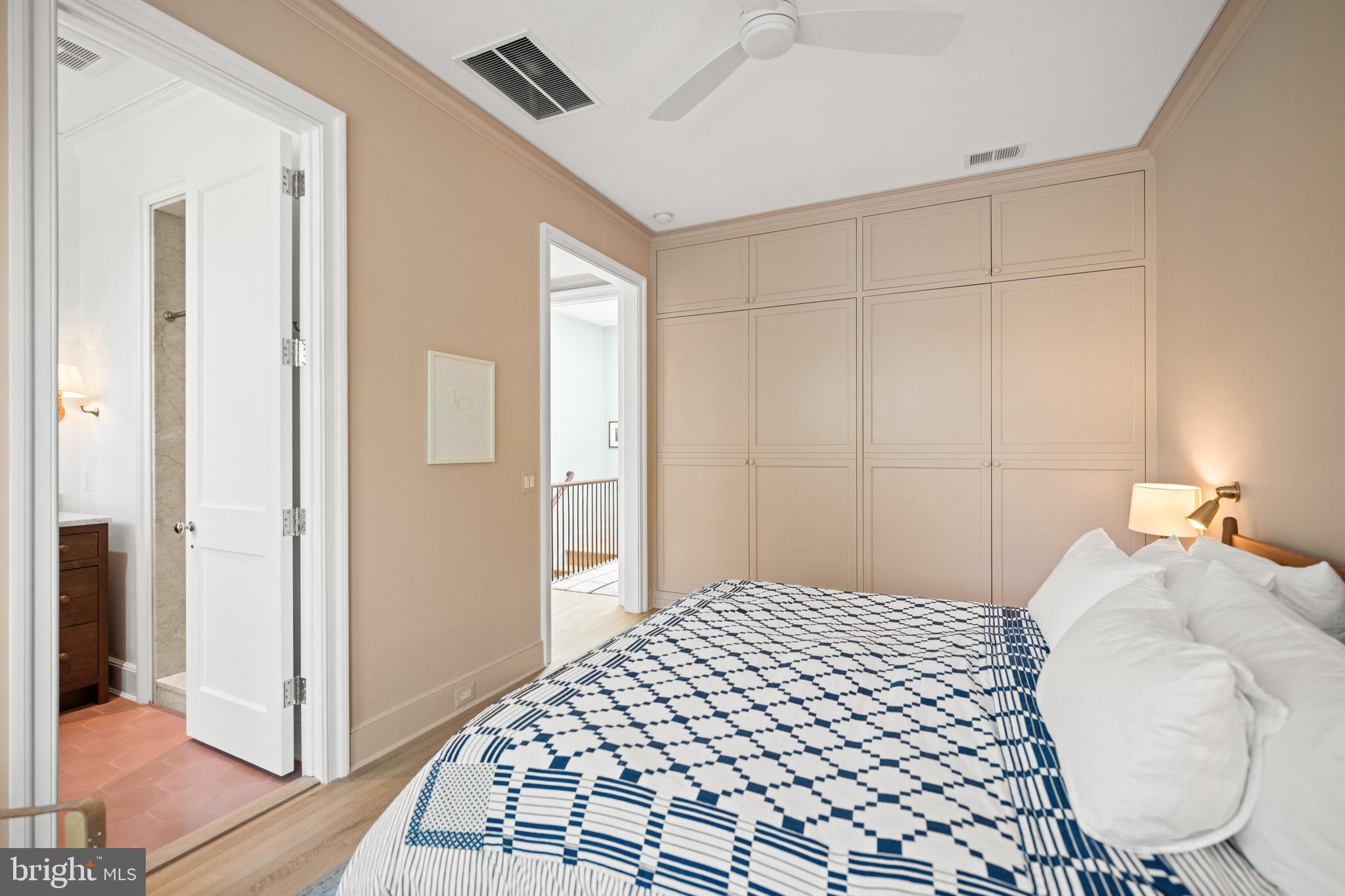 1304 S Street Northwest Washington, DC 20009 - Photo 10 of 23 a bedroom with a bed and a mirror