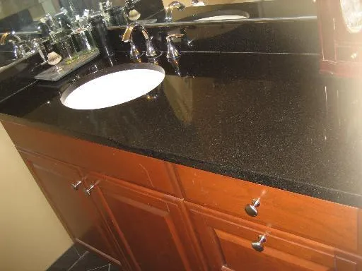 a bathroom with a sink and mirror