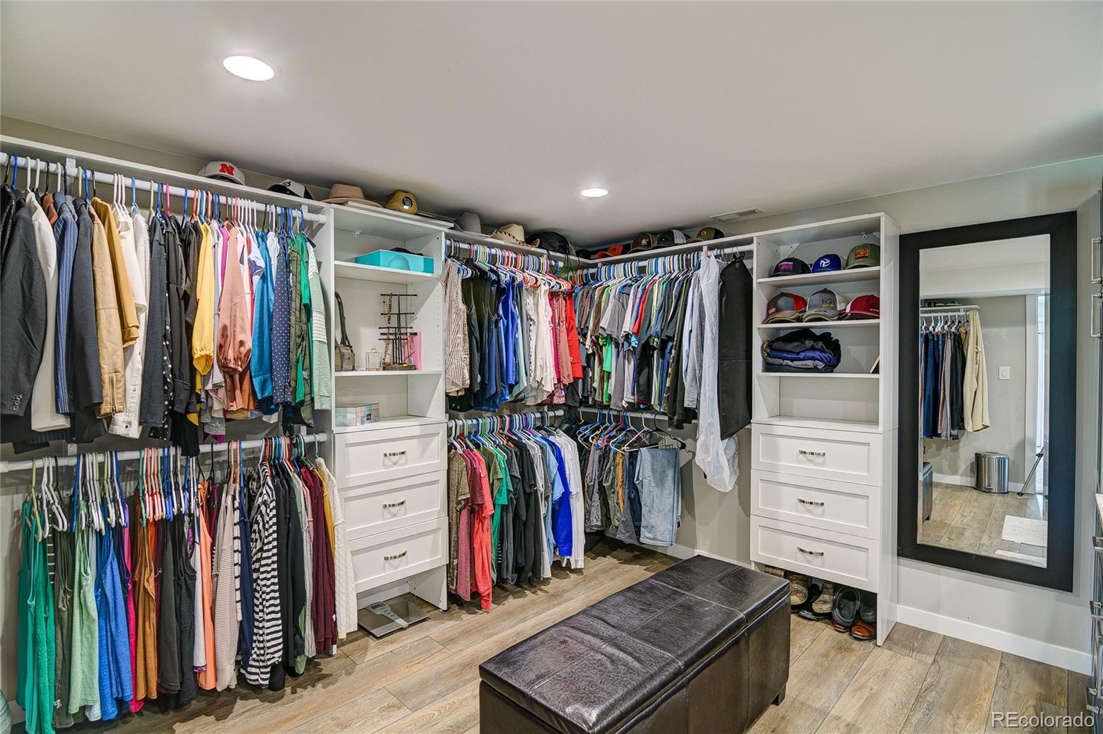 4531 East Best Road Larkspur, CO 80118 - Photo 14 of 49 a view of walk in closet with clothes
