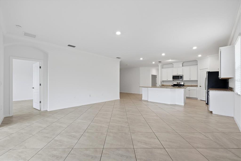 2607 Avolet Court Lakewood Ranch, FL 34211 - Photo 13 of 56 a view of kitchen with kitchen island and stainless steel appliances