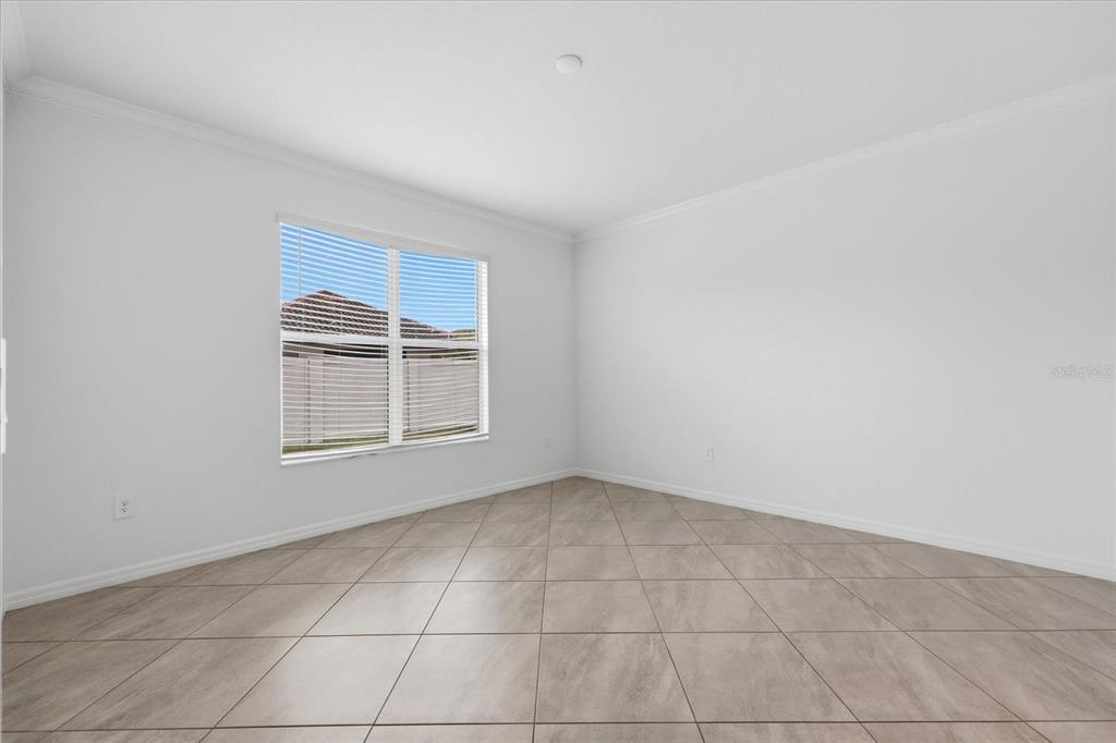 2607 Avolet Court Lakewood Ranch, FL 34211 - Photo 18 of 56 a view of an empty room with a window