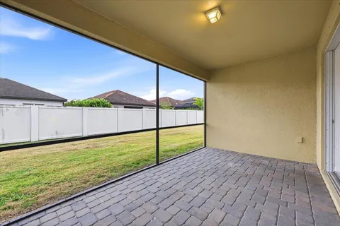an aerial view of residential houses with outdoor space and swimming pool